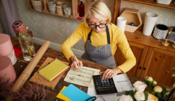 Woman business owner calculating finances