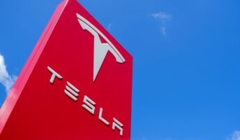 Tesla logo on red sign