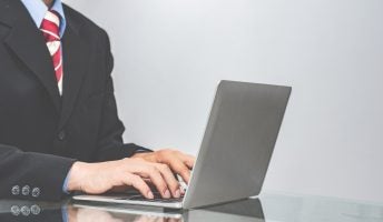 Man in suit working from home
