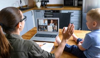 Woman Working from Home with Baby