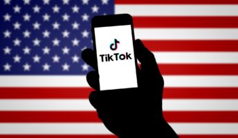 TikTok logo against US flag