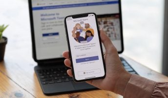 Image of Microsoft Teams app on smartphone and laptop