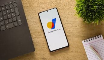 Google Domains logo on phone screen