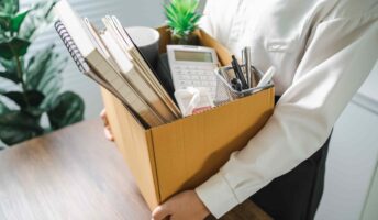 Man packing up belongings from office