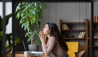 Disengaged worker at her desk