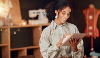Female business owner using an iPad