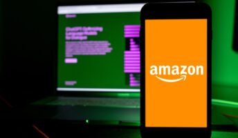 Amazon logo on phone in front of ChatGPT screen