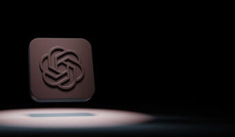 OpenAI logo in spotlight against black background