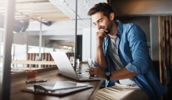Man writing a grant application