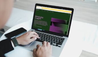 Professional using ChatGPT on laptop