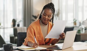 Remote worker writing a grant proposal