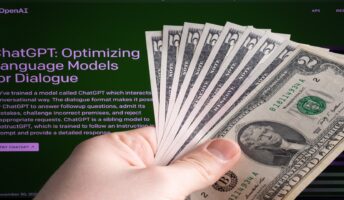 chatgpt login page with hand holding cash