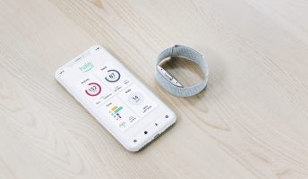 Amazon Halo Band and app on table