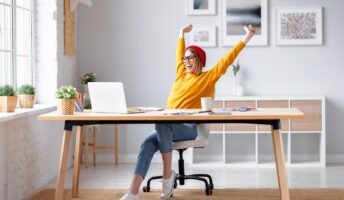 happy remote worker at desk