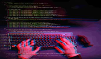 glitching image of person typing on keyboard