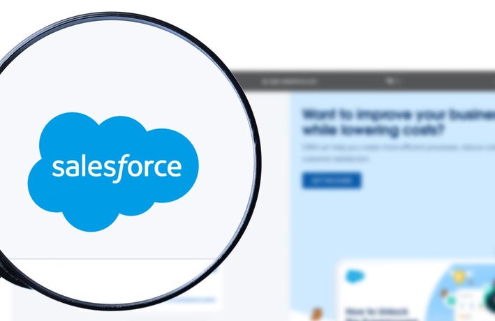 Salesforce logo under magnifying glass illustrating concept of Salesforce review