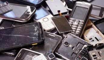 piles of phones in landfill