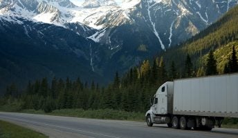 trucker in a business fleet delivering to mountainous area