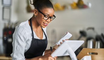 restaurant owner managing inventory ipad pos